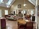 Inviting living room featuring a high ceiling, ceiling fan, and stylish seating for a relaxing atmosphere at 2595 Grapevine Cir, Cumming, GA 30041