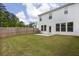 Spacious backyard featuring a well-kept lawn, privacy fence, and exterior view of the home at 2789 Aralynn Way, College Park, GA 30337