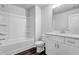 Bathroom featuring a tub-shower combo, white fixtures, and wood-look flooring at 2789 Aralynn Way, College Park, GA 30337