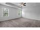 Spacious bedroom with large windows, tray ceiling, and plush carpet at 2789 Aralynn Way, College Park, GA 30337