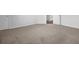 Bedroom showcasing neutral carpet, white walls, and an open door with access to stairs at 2789 Aralynn Way, College Park, GA 30337