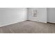 Bright bedroom featuring neutral carpet, white walls, and a window with neighborhood views at 2789 Aralynn Way, College Park, GA 30337