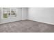 Bedroom with carpet flooring, window, and neutral wall paint at 2789 Aralynn Way, College Park, GA 30337
