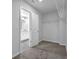 Walk-in closet with carpet flooring, wire shelving, and easy access to the bathroom at 2789 Aralynn Way, College Park, GA 30337
