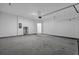 Clean garage with painted concrete floor, large sectional door and utility hookups at 2789 Aralynn Way, College Park, GA 30337