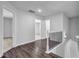 Open hallway with wood flooring and decorative railings leading to bedrooms at 2789 Aralynn Way, College Park, GA 30337