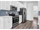 Well lit modern kitchen with stainless steel appliances and white cabinets at 2789 Aralynn Way, College Park, GA 30337
