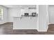 Bright open kitchen with modern backsplash and stainless appliances with breakfast bar at 2789 Aralynn Way, College Park, GA 30337