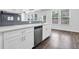 Modern kitchen features stainless appliances, white cabinets, and modern backsplash at 2789 Aralynn Way, College Park, GA 30337