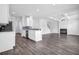 Open concept living room with fireplace and kitchen with stainless appliances at 2789 Aralynn Way, College Park, GA 30337
