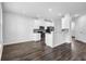 Open concept living room and kitchen with hardwood floors and recessed lighting at 2789 Aralynn Way, College Park, GA 30337