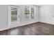 Bright living room with wood-look floors and glass door to backyard at 2789 Aralynn Way, College Park, GA 30337