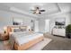 Serene main bedroom showcasing a tray ceiling, neutral tones, and a cozy carpet at 2789 Aralynn Way, College Park, GA 30337