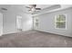 Airy bedroom with natural light, ceiling fan, and an ensuite bath at 2789 Aralynn Way, College Park, GA 30337