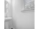 Bright powder room with a sleek pedestal sink and natural light at 2789 Aralynn Way, College Park, GA 30337