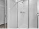 Tiled shower with glass door and chrome fixtures located near the closet entrance at 2789 Aralynn Way, College Park, GA 30337