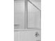 Close-up of a tiled shower with glass doors and chrome fixtures at 2789 Aralynn Way, College Park, GA 30337