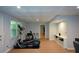 Finished basement with gym equipment, recessed lighting and modern flooring at 3295 Waters Ml, Alpharetta, GA 30022
