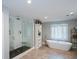 Modern bathroom features a glass walk-in shower and separate tub at 3295 Waters Ml, Alpharetta, GA 30022