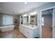 Bright bathroom with soaking tub, dual vanity, and modern fixtures at 3295 Waters Ml, Alpharetta, GA 30022