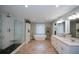Modern bathroom featuring a soaking tub, walk-in shower, and double vanity at 3295 Waters Ml, Alpharetta, GA 30022