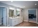Lovely bathroom with double vanity and doorways to bedroom and closet at 3295 Waters Ml, Alpharetta, GA 30022