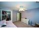 Bedroom with purple walls, closet, dresser, ceiling fan, and natural light from the window at 3295 Waters Ml, Alpharetta, GA 30022