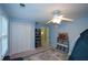 bedroom featuring a tented bed, open closet, gray area rug, shelving and ceiling fan at 3295 Waters Ml, Alpharetta, GA 30022