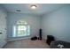 Bedroom with a window, carpeted floor, and a neutral color scheme offers a cozy, customizable space at 3295 Waters Ml, Alpharetta, GA 30022