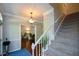 Open foyer with hardwood flooring, a staircase, and a view into the adjacent living room at 3295 Waters Ml, Alpharetta, GA 30022
