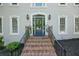 Close up of the blue front door framed by sidelights and overhead arched window at 3295 Waters Ml, Alpharetta, GA 30022