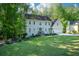 Charming two-story home with a well-manicured lawn and mature trees in a lush neighborhood at 3295 Waters Ml, Alpharetta, GA 30022
