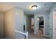 Upstairs hallway featuring neutral walls, carpeted flooring, and access to multiple rooms at 3295 Waters Ml, Alpharetta, GA 30022