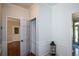 Bright hallway with hardwood floors, white wainscoting, and multiple doorways at 3295 Waters Ml, Alpharetta, GA 30022