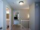 Bright hallway with neutral walls leads to bathroom and bedroom at 3295 Waters Ml, Alpharetta, GA 30022