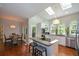 Bright kitchen featuring an island with barstools, stainless steel appliances, and ample natural light at 3295 Waters Ml, Alpharetta, GA 30022