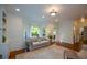 Bright living room with hardwood floors, recessed lighting, and large windows with white draperies at 3295 Waters Ml, Alpharetta, GA 30022