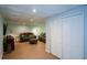Cozy living room features laminate floors, comfortable seating, and closet doors for convenient storage at 3295 Waters Ml, Alpharetta, GA 30022
