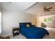 Cozy main bedroom with blue bedding, ceiling fan, and sitting area at 3295 Waters Ml, Alpharetta, GA 30022