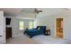 Bright main bedroom with tray ceiling, blue bedding and two windows at 3295 Waters Ml, Alpharetta, GA 30022