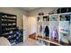 Mud room featuring built-in storage, dark storage shelving and interior access to an adjacent room at 3295 Waters Ml, Alpharetta, GA 30022