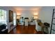 Bright home office with hardwood floors, white trim, built-in shelving, and dual work stations at 3295 Waters Ml, Alpharetta, GA 30022