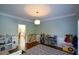 Charming playroom with hardwood floors, playful décor, and well-organized shelving for toys and books at 3295 Waters Ml, Alpharetta, GA 30022