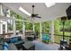 Screened porch with comfortable seating, fan, skylights and wooded views at 3295 Waters Ml, Alpharetta, GA 30022