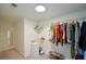Well-organized walk-in closet with rod and shelf storage and a laundry chute for convenience at 3295 Waters Ml, Alpharetta, GA 30022