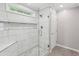 Modern tiled shower featuring glass door and custom tile at 4938 Cedar Lake Ter, Douglasville, GA 30135
