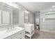 This bathroom features dual vanities, and a glass-enclosed tiled shower at 4938 Cedar Lake Ter, Douglasville, GA 30135