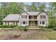 Charming two-story home featuring a landscaped yard and a welcoming exterior at 4938 Cedar Lake Ter, Douglasville, GA 30135