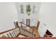 Open foyer with wood staircase, chandelier, and views of the front door, hardwood flooring and a light-filled interior at 4938 Cedar Lake Ter, Douglasville, GA 30135