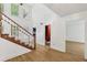 Foyer featuring hardwood floors, staircase, and access to multiple rooms at 4938 Cedar Lake Ter, Douglasville, GA 30135